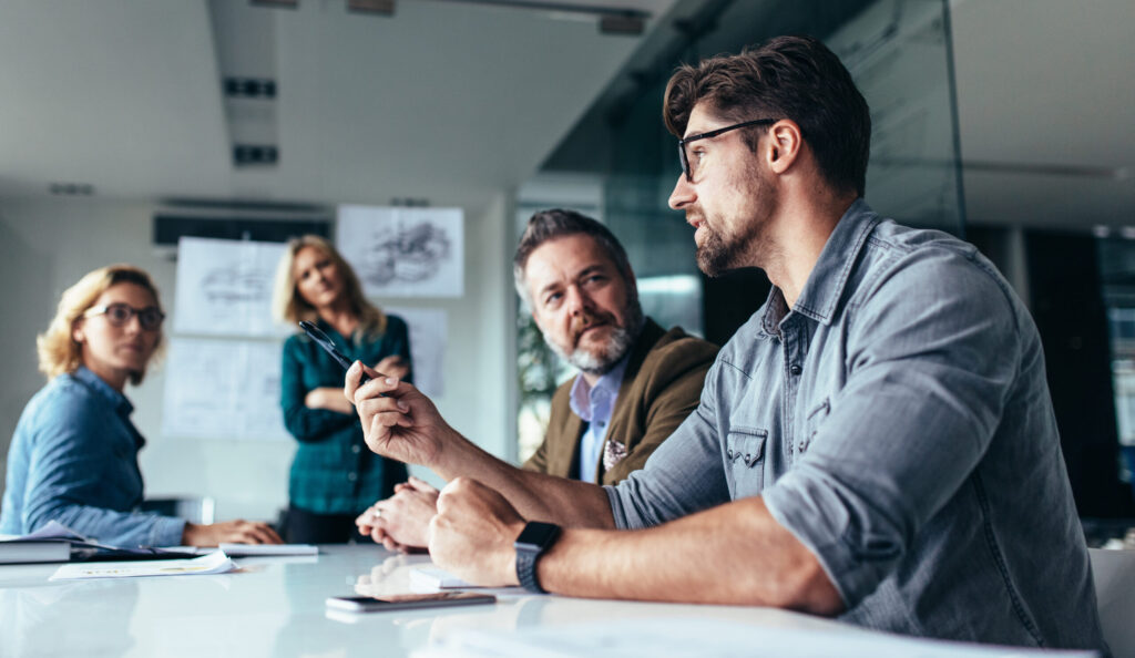 Advisors discussing a car finance claim check with a customer